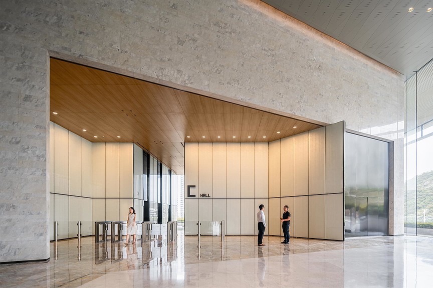 People standing in a large room.